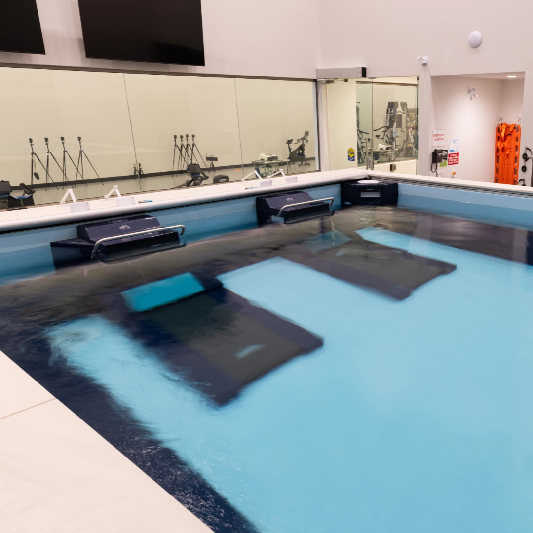 Hydrotherapy pool with underwater treadmills for rehabilitation therapy.